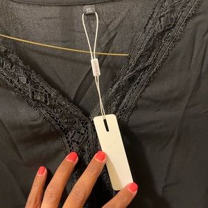 Brand new black blouse laced down color and front of shirt